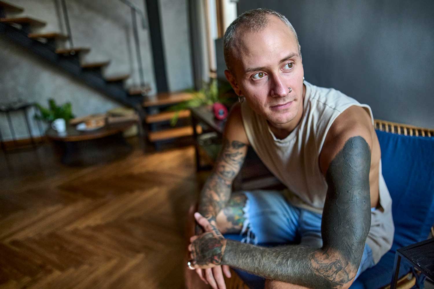 Photo of man with tattoos
