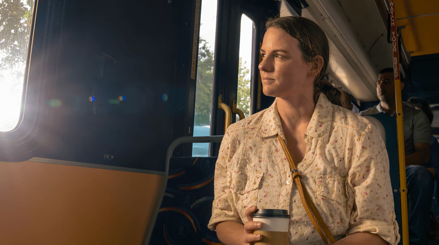 Woman sitting on bus in the morning